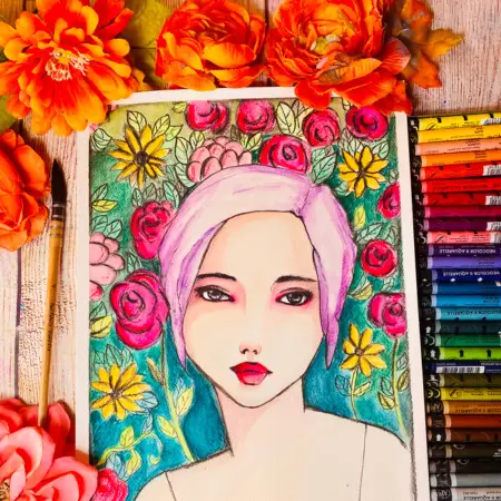 art journal page of girl surrounded with flowers next to a paint brush and a Neocolor II pallet